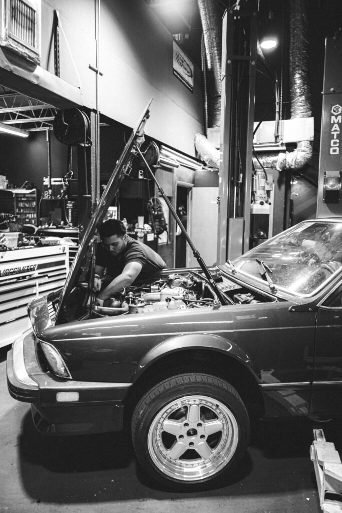 Mechanic working in a garage at Martinez Auto Repair, the business that led to Family Vehicles LLC in Indio.